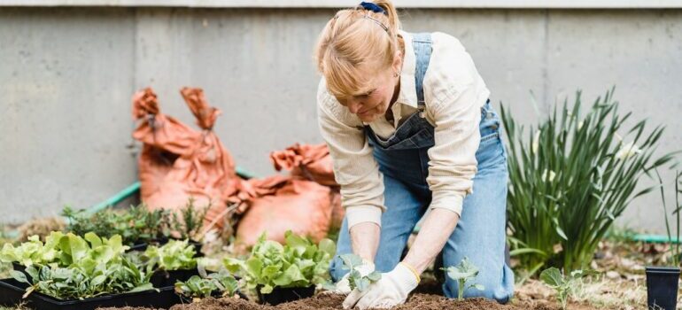 Woman planting in her backyard