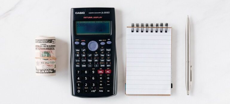 Money, calculator and a paper and a pen
