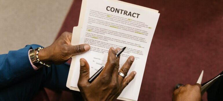 A person holding a contract 