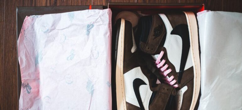 Sneakers in the box as example of how to pack and store shoes 